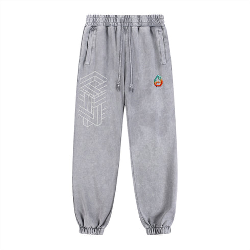 Gray sweatpants with geometric design and colorful logo on a white background