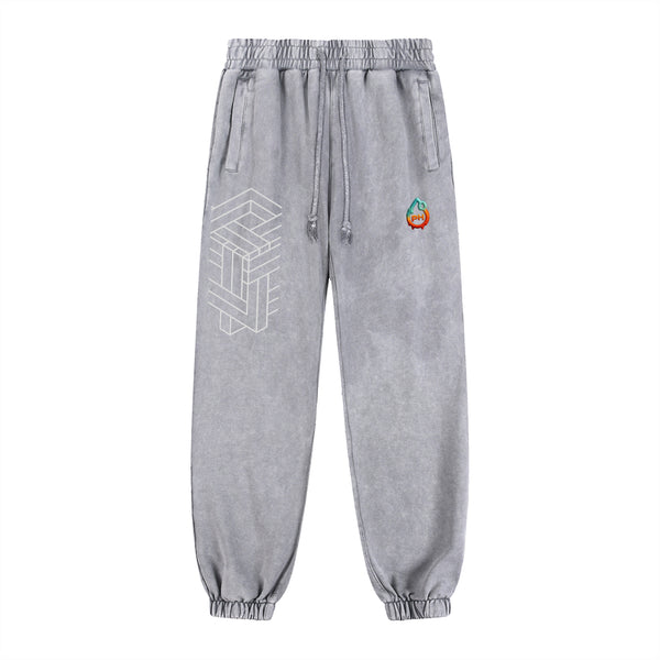 Gray sweatpants with geometric design and colorful logo on a white background