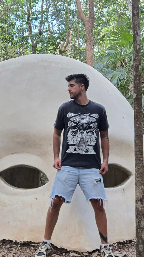 Danilo is 6'2" 180 lbs and wearing size M. He's standing in front of a white architectural structure with trees in the background.