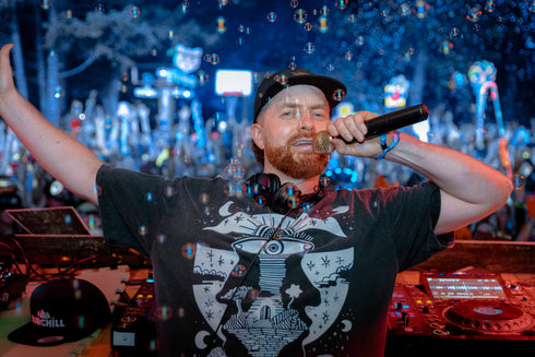 Rising star on the festival scene, Burchill, rocking the Lunar Enigma Fluffy vintage tee at Shambala music festival