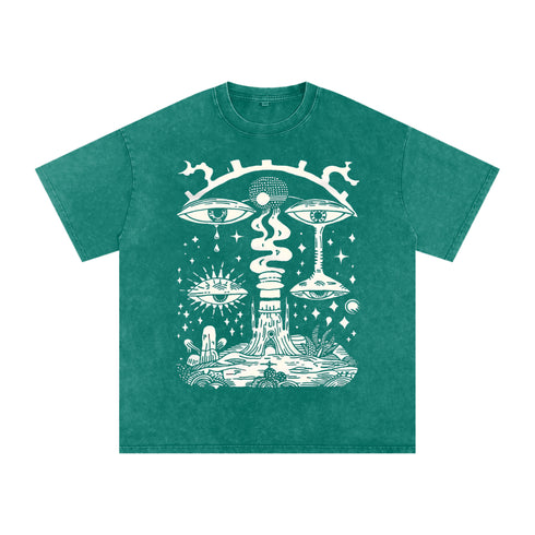 Paradoxical Perspective acid wash tee in green with psychedelic art design featuring eyes and cosmic motifs