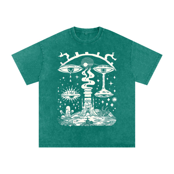 Paradoxical Perspective acid wash tee in green with psychedelic art design featuring eyes and cosmic motifs