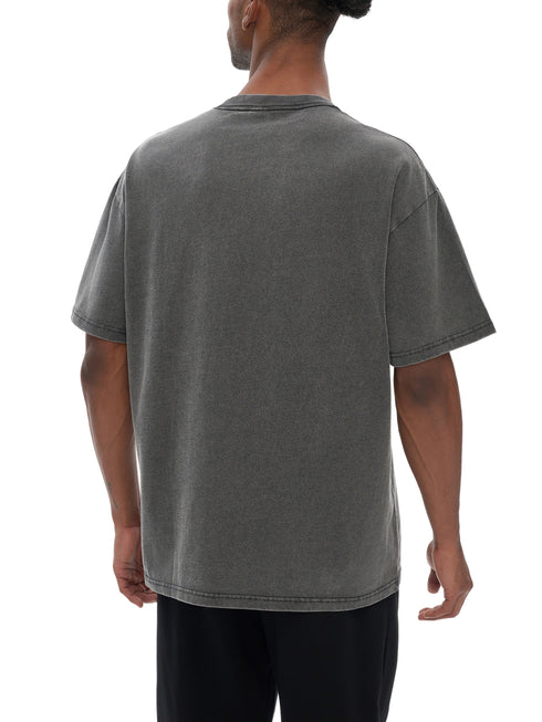 Person wearing a gray t-shirt on a white background