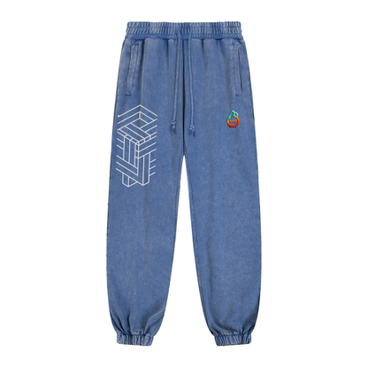 Blue denim jogger pants with geometric design on a white background