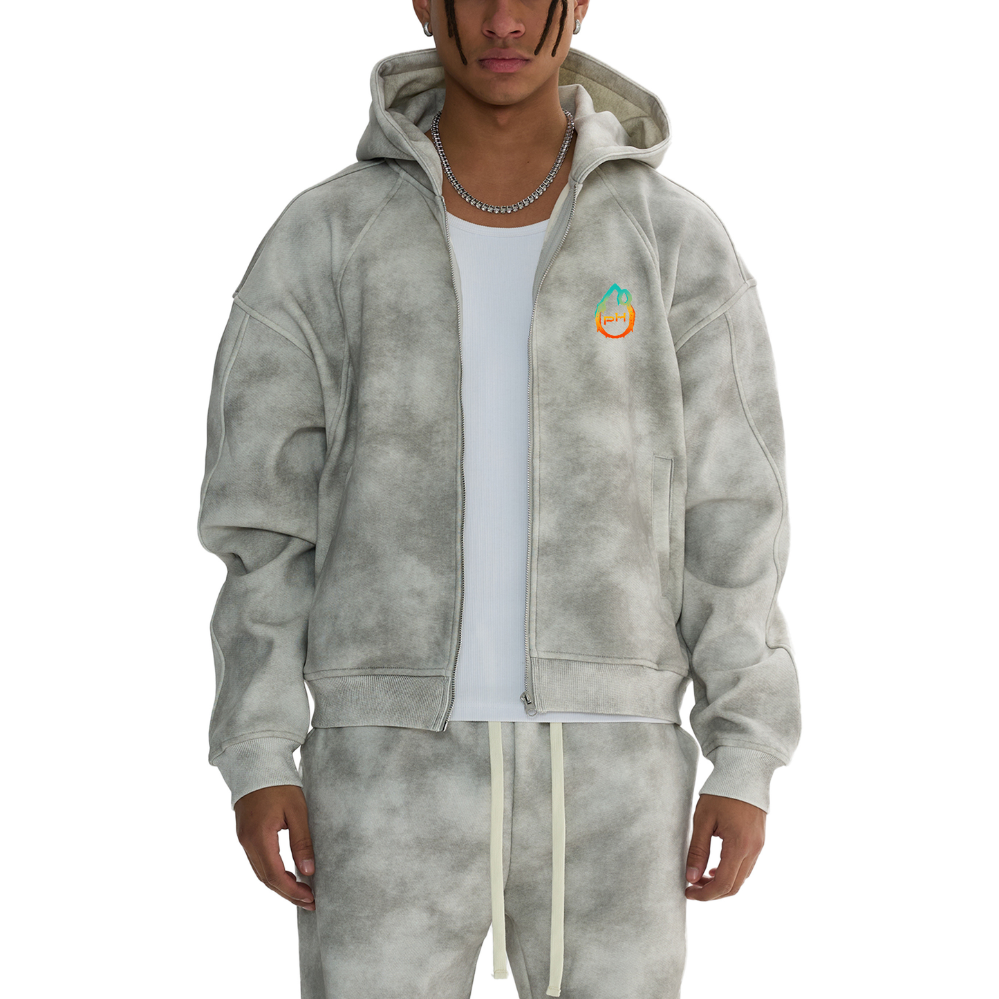 Person wearing a gray tie-dye hoodie with a logo on a white background