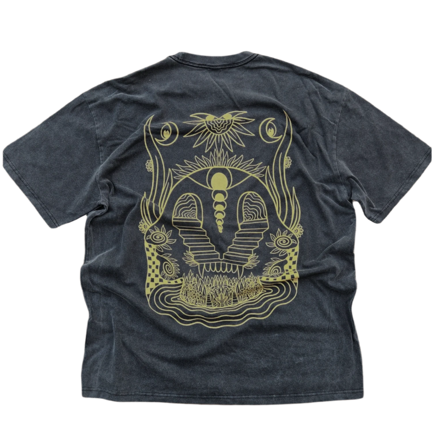 Dark blue t-shirt with gold graphic design on a wooden surface