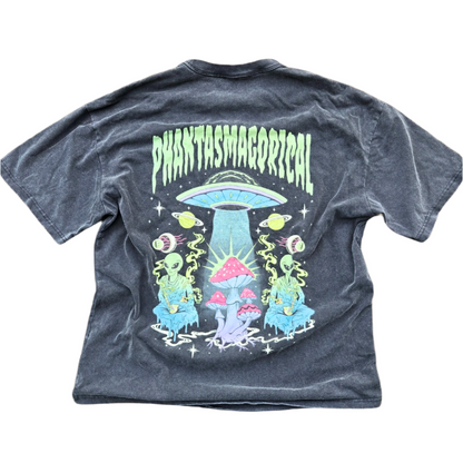 A black vintage heavyweight t-shirt with a graphic print in the center featuring a spaceship and various celestial bodies, with the word 'PHANTASMAGORICAL' above it.