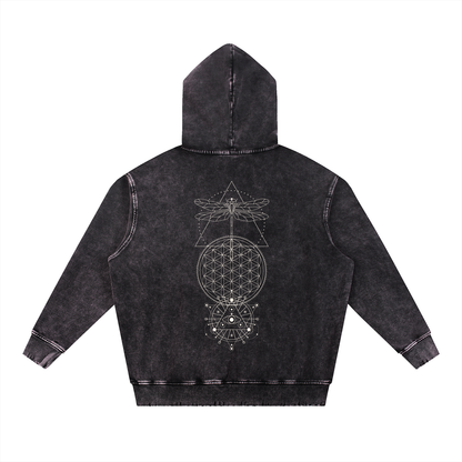 Black hoodie with sacred geometry design on the back against a white background