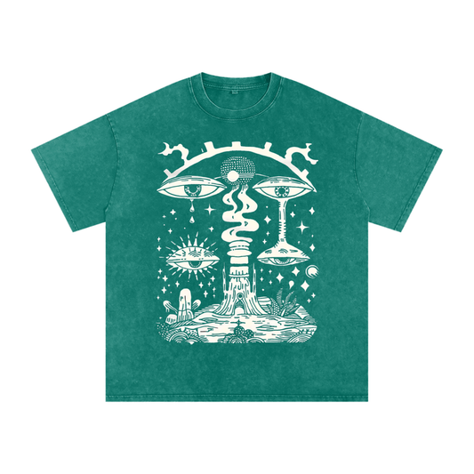 Paradoxical Perspective acid wash tee in green with psychedelic art design featuring eyes and cosmic motifs