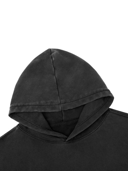 Close up of 400 GSM heavyweight cotton texture with vintage snow wash effect and distressed hem detailing.